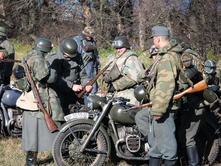 PETRIVTSI, UKRAINE - NOVEMBER 04: Soldiers of the Wehrmacht during the reconstruction of the battle for the liberation by Soviet troops Lyutezh beachhead during World War II on November 04, 2007 in Petrivtsi (near Kiev), Ukraineのeditorial素材