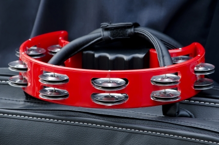Red tambourine against a black backgroundの写真素材