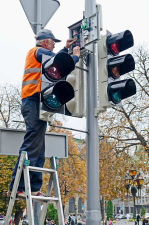LVOV, UKRAINE - OCTOBER 16: Technical workers in the heart of the city will replace the updated...