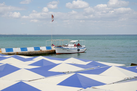 FEODOSIA, CRIMEA, RUSSIA - JUNE 12   Old pleasure boat on a mooring on the central waterfront on June 12, 2014 in Feodosia, Crimea, Russiaのeditorial素材