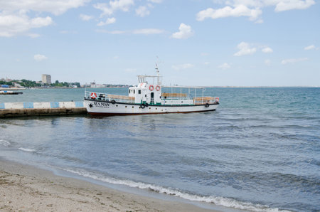 FEODOSIA, CRIMEA, RUSSIA - JUNE 12   Old pleasure boat on a mooring on the central waterfront on June 12, 2014 in Feodosia, Crimea, Russiaのeditorial素材