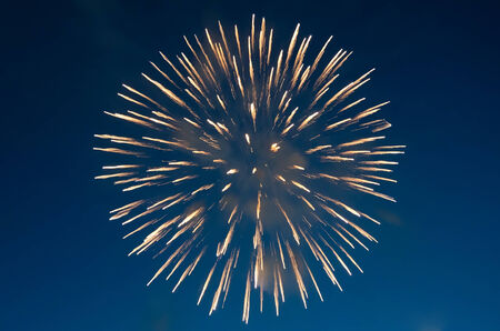 Beautiful fireworks close-up on the background of blue skyの写真素材