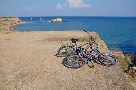 KERCH, CRIMEA, RUSSIA - AUGUST 09: Bike tourists on the coast near Kerch in the Crimea on august 09, 2014 in Kerch, Crimea, Russiaのeditorial素材