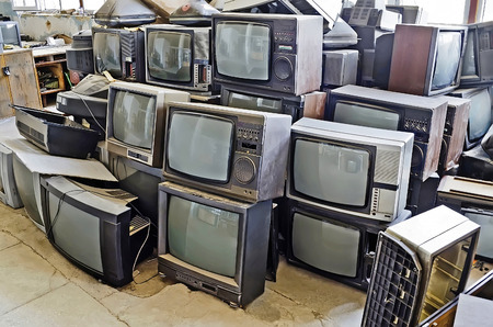 Pile of non-working old TVs close-upの写真素材