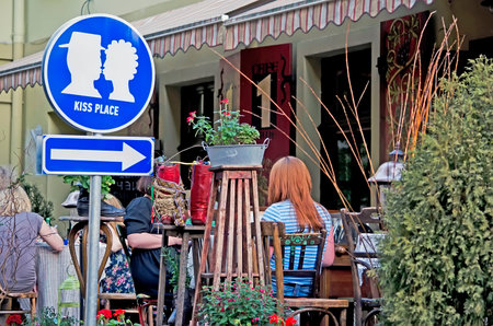 LVOV, UKRAINE - APRIL 29: Attraction of Lvov - pointer \"Kiss place\" in the art cafe on Cathedral Square (in the center of Lvov) on April 29, 2012 in Lvov, Ukraine.のeditorial素材