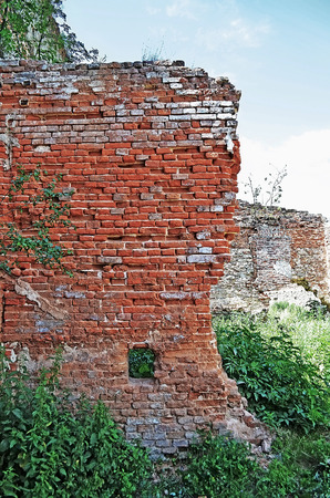The old wall of red brick in an old castle in the Stare Selo, close to the Lvov city (Ukraine). Built 15th century.の写真素材