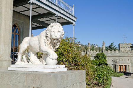 Architectural landmark - Sculpture of a lion of white marble with ball in the Vorontsov Palace in Alupka, Yalta, Crimeaのeditorial素材