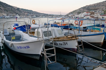 SEVASTOPOL, CRIMEA, RUSSIA - NOVEMBER 04: Many motor Boats at the pier in Balaclava on November 04, 2014 in Sevastopol, Crimea, Russiaのeditorial素材