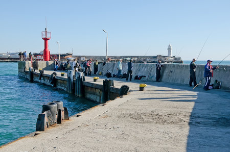 YALTA, CRIMEA, RUSSIA - NOVEMBER 06: Fishermen on the seafront of Yalta on November 06, 2014 in Yalta, Crimea, Russiaのeditorial素材