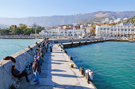 YALTA, CRIMEA, RUSSIA - NOVEMBER 06: Fishermen on the seafront of Yalta on November 06, 2014 in Yalta, Crimea, Russiaのeditorial素材
