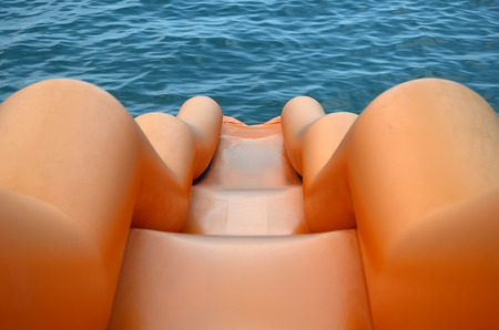 Fun on the beach - orange water slide close-upの写真素材