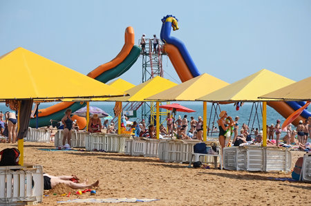 KERCH, CRIMEA, RUSSIA - AUGUST 17: View on the city beach and attraction - water slide in Kerch on August 17, 2015 in Kerch, Crimea, Russiaのeditorial素材