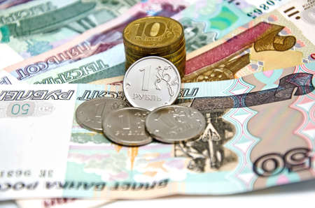 Business background - Metal coins on paper bills and (Russian rubles)の写真素材