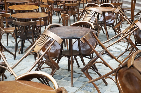 Tables and chairs in empty restaurantの写真素材