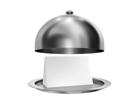 Open restaurant cloche (dome cover) with dish on which lay a paper template, isolated on a white backgroundの写真素材