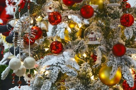 Beautiful Christmas background - christmas tree close-up decorated with christmas balls and snow. Happy new year!の写真素材