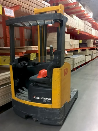 LVIV, UKRAINE - FEBRUARY 01:  Forklift truck (electric car) closeup on the background of shelves with boards in the building supermarket "EpiCentre K" in Lvov on February 01, 2017 in Lviv, Ukraineのeditorial素材