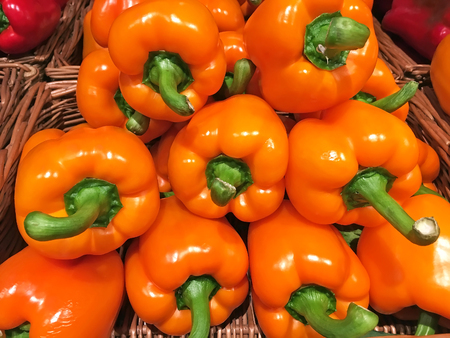 Food background Orange bell pepper in stack closeupの写真素材