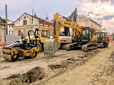 LVIV, UKRAINE - JUNE 23: Construction machinery during the major overhaul of the road in Lychakivska Street in Lviv on June 23, 2017 in Lvov, Ukraineのeditorial素材
