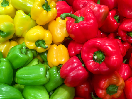 Food background - Pile of ripe red and green bell pepper close-upの写真素材