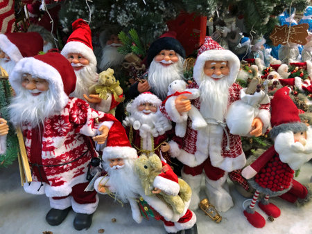 LVIV, UKRAINE - DECEMBER 03: Santa Claus Christmas dolls lying under the Christmas tree in a supermarket "Epicentr" on December 03, 2019 in Lvov, Ukraineのeditorial素材