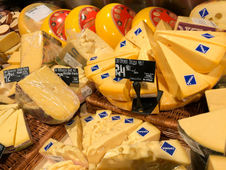 LVIV, UKRAINE - OCTOBER 16: Hard cheese in assortment lying in a showcase in a supermarket Silpo on October 16, 2019 in Lvov, Ukraineのeditorial素材