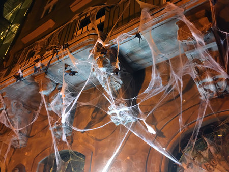 LVIV, UKRAINE - OCTOBER 29: The facade of the building in the center of Lviv decorated by a scary web and bats in honor of the Halloween holiday on October 29, 2018 in Lvov, Ukraineのeditorial素材