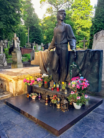LVIV, UKRAINE - JUNE 04, 2019: Tombstone sculpture of the Ukrainian singer and musician Volodymyr Ivasyuk at the Lychakiv cemetery in Lvovのeditorial素材
