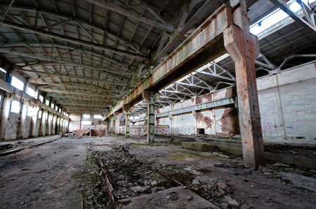 Old and deserted plant interior with weathered walls and overlapの写真素材