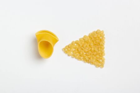 Raw italian pasta on a white background