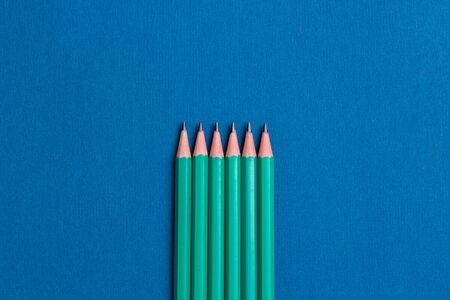 isolated pencils on blue backgroundの写真素材