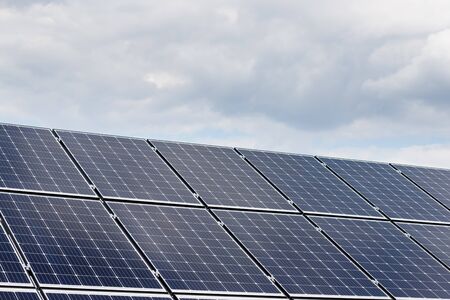 close-up view of solar panels on a background of blue skyの写真素材