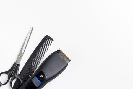 hair clipper, scissors and comb on a white backgroundの写真素材