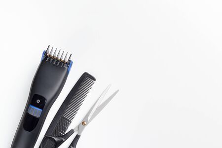 hair clipper, scissors and comb on a white backgroundの写真素材