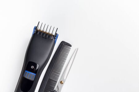 hair clipper, scissors and comb on a white backgroundの写真素材