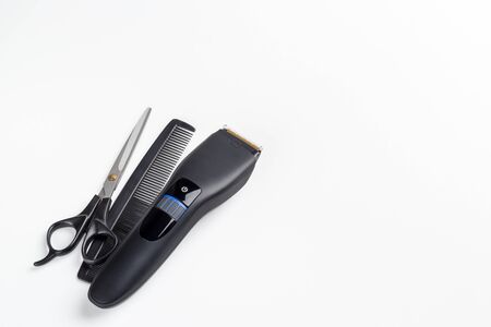hair clipper, scissors and comb on a white backgroundの写真素材