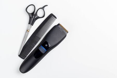 hair clipper, scissors and comb on a white backgroundの写真素材