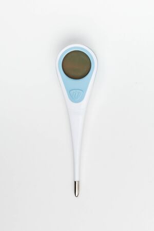 Electronic thermometer on a white backgroundの写真素材