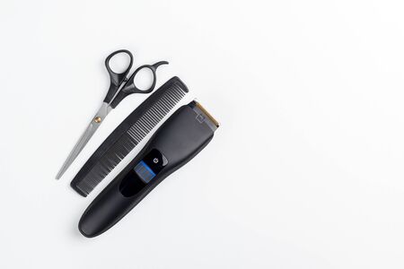 hair clipper, scissors and comb on a white backgroundの写真素材
