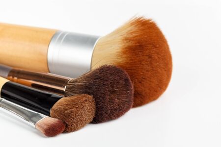 Makeup brushes of different sizes on a white backgroundの写真素材
