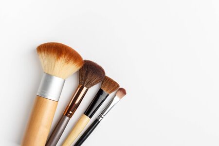 Makeup brushes of different sizes on a white backgroundの写真素材