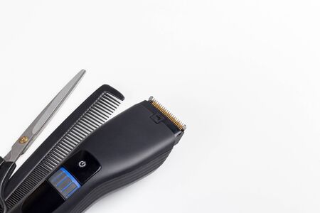 hair clipper, scissors and comb on a white backgroundの写真素材