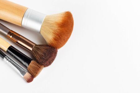 Makeup brushes of different sizes on a white backgroundの写真素材