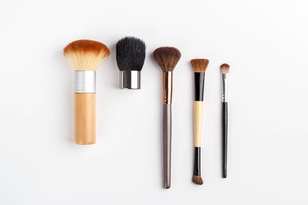 Makeup brushes of different sizes on a white backgroundの写真素材