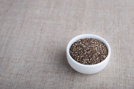 Chia beans in a bowl on the tableの写真素材