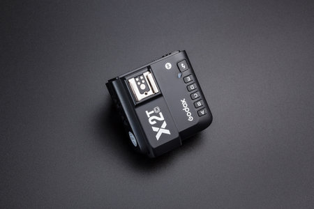 Kamyanets-Podilskyi, Ukraine - May 22, 2020: Radio synchronizer transmitter Godox X2T-C on black background.のeditorial素材