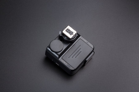 Kamyanets-Podilskyi, Ukraine - May 22, 2020: Radio synchronizer transmitter Godox X2T-C on black background.のeditorial素材