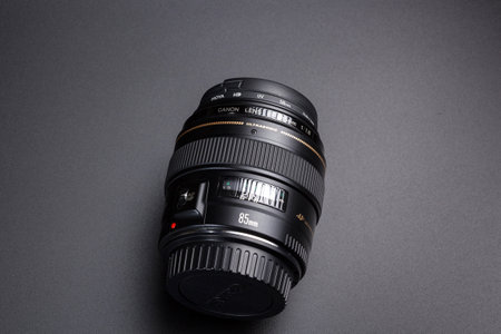 Kamyanets-Podilskyi, Ukraine - May 22, 2020: Canon EF-85mm F / 1.8 USM Lens on black blackground.のeditorial素材