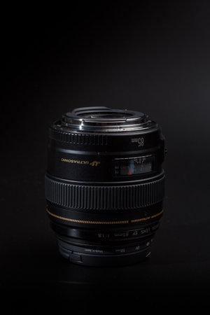 Kamyanets-Podilskyi, Ukraine - May 22, 2020: Canon EF-85mm F / 1.8 USM Lens on black blackground.のeditorial素材