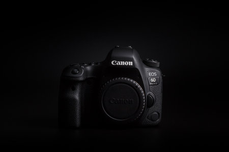 Kamyanets-Podilskyi, Ukraine - May 22, 2020: Canon EOS 6D Mark II Body on black background. Front view.のeditorial素材